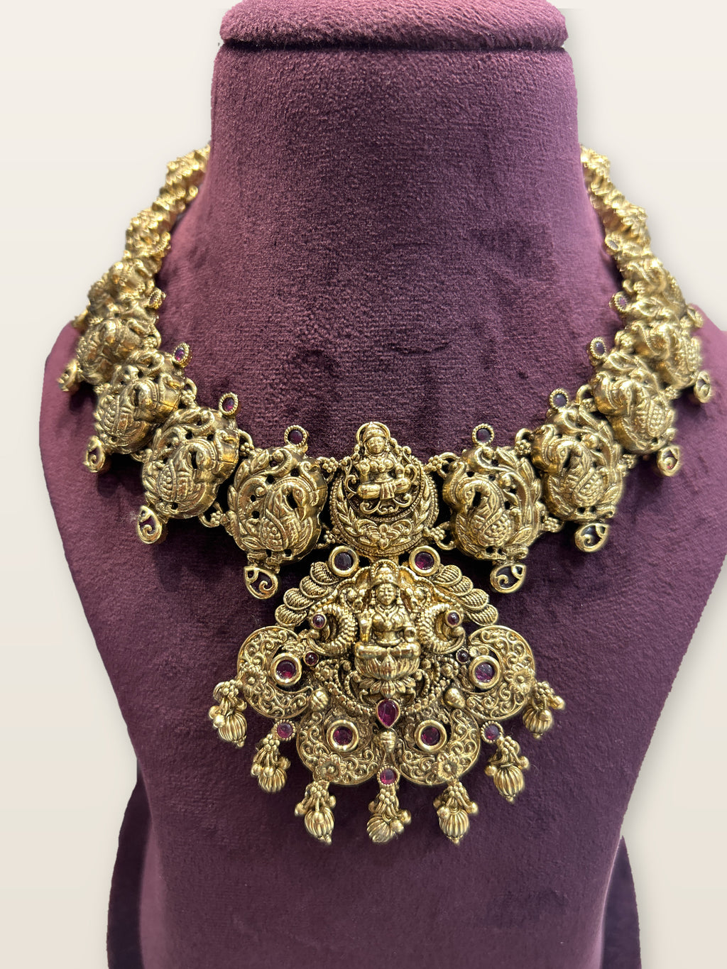 Lakshmi Mayura Temple Necklace Set, shown on a display bust